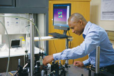 Sandile Ngcobo with the digital laser experimental setup.